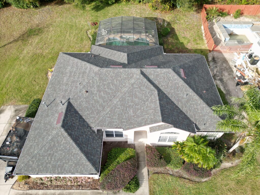 Image shows Florida home with a CertainTeed shingle roof. Color is "Driftwood".