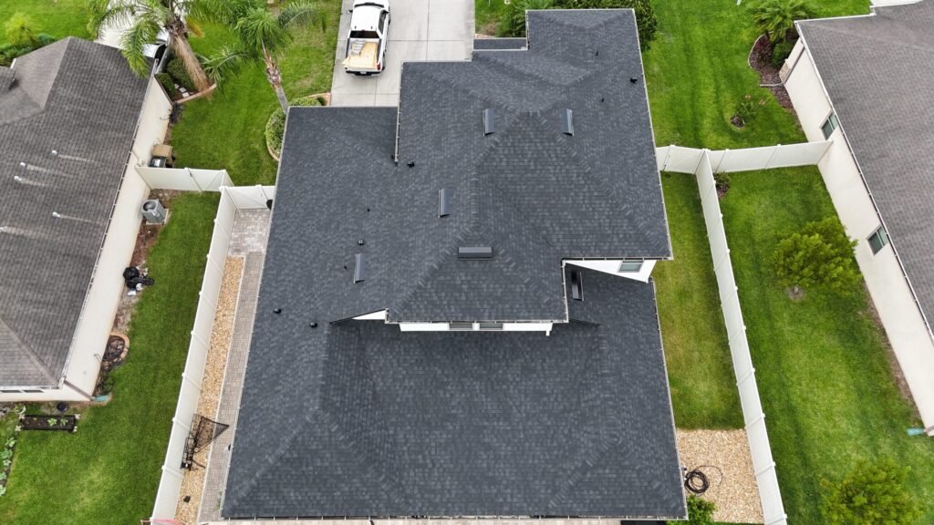 Image shows Lake County Florida home with newly installed asphalt shingle roof by Eave & Gable Roofing