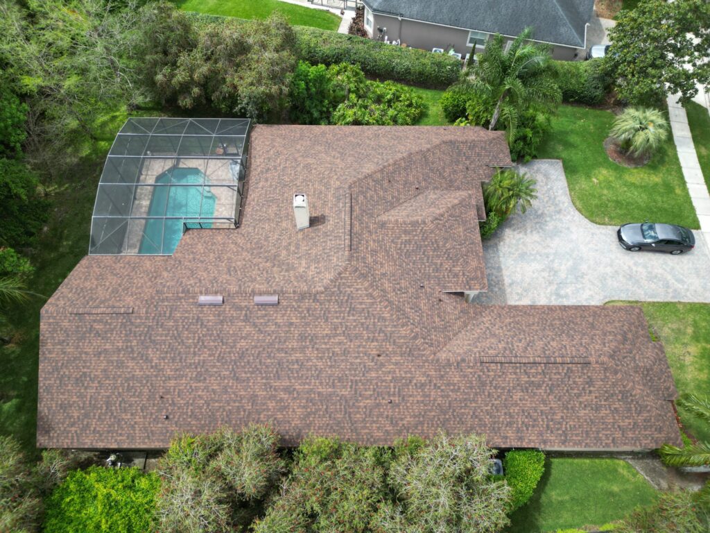 Image shows roof of Polk County Florida home with new architectural shingles by CertainTeed. Installed by Eave & Gable Roofing.