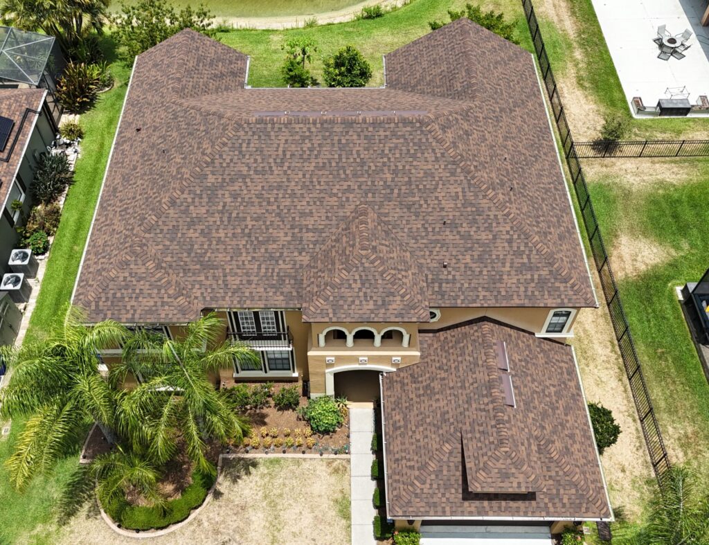 Image shows beautiful home in Osceola County Florida with a recently installed architectural shingle roof.