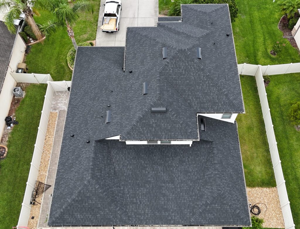 Image shows Sumter County Florida home with newly installed asphalt shingle roof.